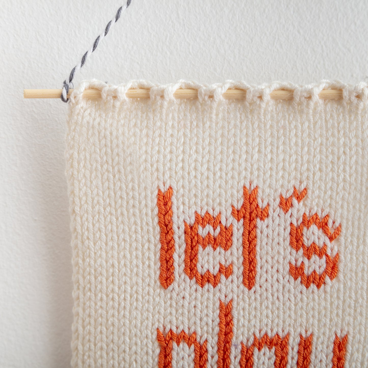 let's play knitted wall hanging