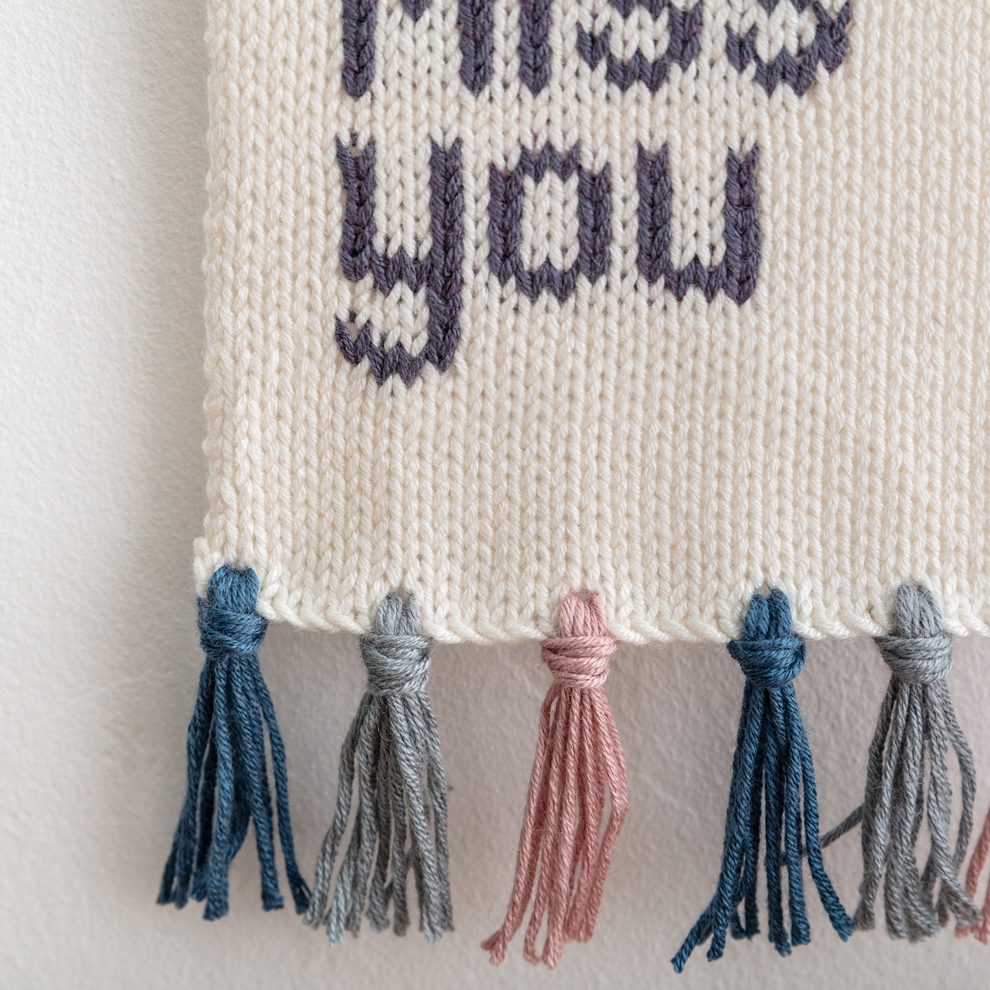 love you miss you knitted wall hanging