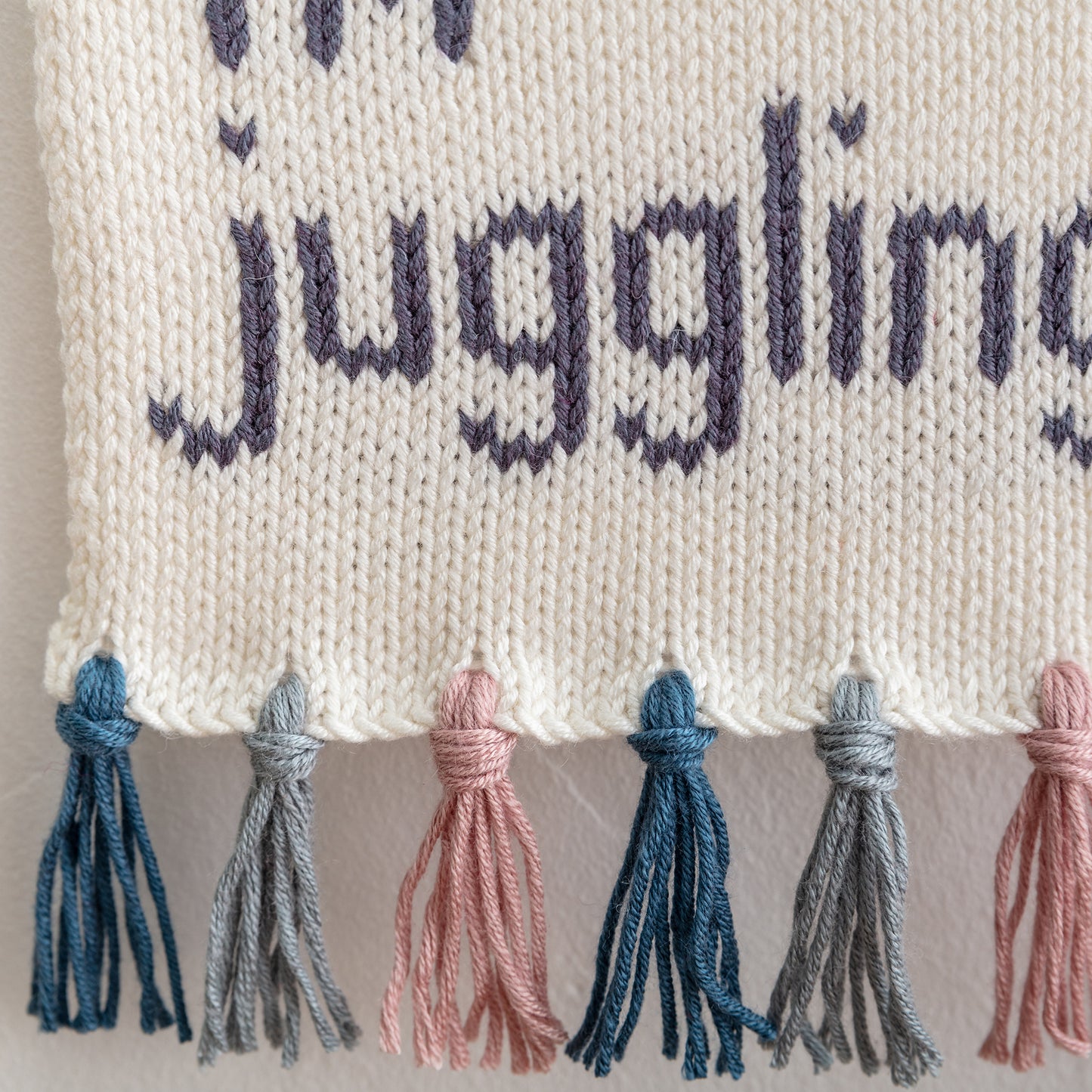 Everyday I'm juggling knitted wall hanging