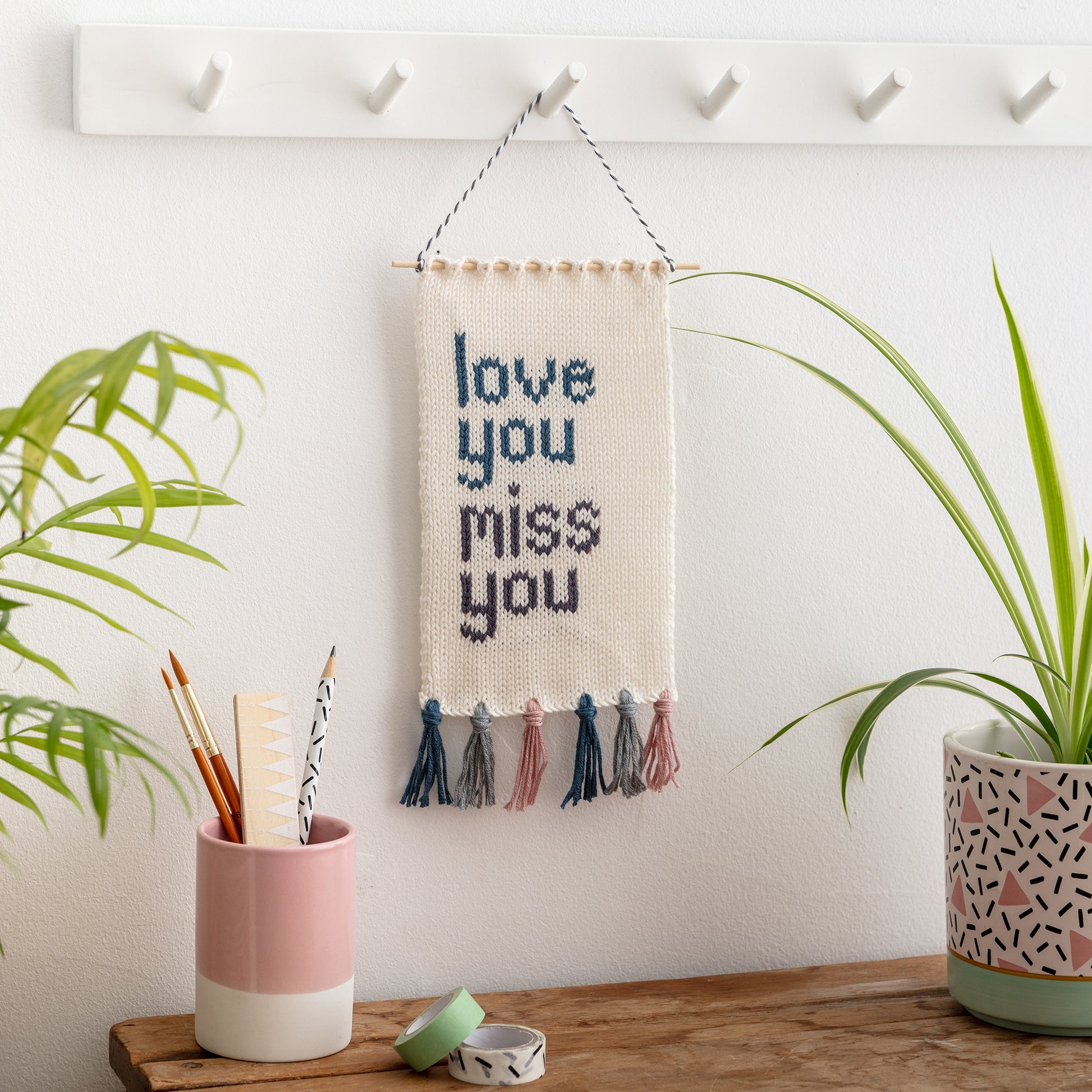 love you miss you knitted wall hanging